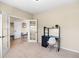 Cozy carpeted office with a modern desk and chair, featuring double french doors and ample natural light at 28340 Dylon Cir, Elizabeth, CO 80107