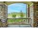 Covered porch with stone pillars offering scenic views of the surrounding landscape at 28340 Dylon Cir, Elizabeth, CO 80107