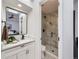 Modern bathroom with marble shower and white vanity at 1218 Ascot Ave, Highlands Ranch, CO 80126