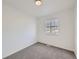 Simple bedroom with a window and neutral carpet at 1218 Ascot Ave, Highlands Ranch, CO 80126