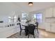 Bright dining area with a round table and chairs, offering views from a kitchen at 1218 Ascot Ave, Highlands Ranch, CO 80126