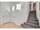 Bright and spacious entryway with hardwood floors, leading to stairs and other rooms at 1218 Ascot Ave, Highlands Ranch, CO 80126