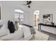 Main bedroom with en-suite bathroom and ceiling fan at 1218 Ascot Ave, Highlands Ranch, CO 80126