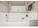 Soaking tub with white tile surround and decor at 13263 Niwot Trl, Broomfield, CO 80020