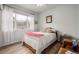 Cozy bedroom featuring a bright window, and light wood floors at 13263 Niwot Trl, Broomfield, CO 80020
