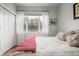 Bedroom featuring a bright window, and light wood floors at 13263 Niwot Trl, Broomfield, CO 80020