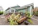 Charming deck with beautiful landscaping, planters, and a dining set is ideal for enjoying the outdoors and entertaining guests at 13263 Niwot Trl, Broomfield, CO 80020