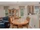 Inviting dining area with a wooden table, chairs, and natural light at 13263 Niwot Trl, Broomfield, CO 80020
