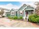 Craftsman style home with tidy landscaping, red shutters, covered porch, and a 2-car garage at 13263 Niwot Trl, Broomfield, CO 80020