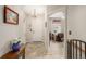 Foyer featuring a tile floor, chandelier, and an adjacent home office space with wood laminate floor at 13263 Niwot Trl, Broomfield, CO 80020