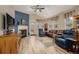 Bright living room features a fireplace, ceiling fan, and neutral color palette at 13263 Niwot Trl, Broomfield, CO 80020