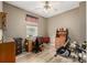 Home office featuring wood laminate flooring, neutral walls, ceiling fan, and a window at 13263 Niwot Trl, Broomfield, CO 80020