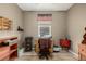 Home office with wood laminate flooring, natural light, ample storage, and a ceiling fan at 13263 Niwot Trl, Broomfield, CO 80020