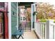 Cozy covered porch with seating, plants and outdoor decor at 13263 Niwot Trl, Broomfield, CO 80020