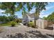 Landscaped backyard with a shed and gravel at 6858 Johnson St, Arvada, CO 80004