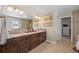 Elegant bathroom with double vanity and walk-in shower at 6858 Johnson St, Arvada, CO 80004