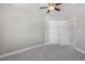 Cozy bedroom with ceiling fan and double door closet at 6858 Johnson St, Arvada, CO 80004