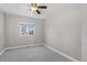 Bright and airy bedroom with ceiling fan and large window at 6858 Johnson St, Arvada, CO 80004