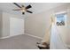 Spacious bedroom with ceiling fan and a large closet at 6858 Johnson St, Arvada, CO 80004