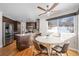 Modern kitchen with dark wood cabinets, granite counters, and stainless steel appliances at 6858 Johnson St, Arvada, CO 80004