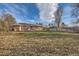 Exterior view of a home with a large, grassy backyard and wooden fence at 2675 N Saint Paul St, Denver, CO 80205