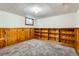 Cozy basement with carpet and wood paneling, perfect for storage or entertainment at 2675 N Saint Paul St, Denver, CO 80205