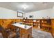 Basement area features wood paneling, carpet, and a built-in bookshelf at 2675 N Saint Paul St, Denver, CO 80205