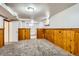 Finished basement with wood paneling provides a cozy and functional space for various activities at 2675 N Saint Paul St, Denver, CO 80205