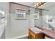 Bathroom featuring a tub, shower, and sink at 2675 N Saint Paul St, Denver, CO 80205