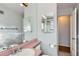 Bathroom featuring a sink with a large mirror and a view of the shower at 2675 N Saint Paul St, Denver, CO 80205