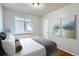 Well-lit bedroom with a bed, a window, and neutral decor at 2675 N Saint Paul St, Denver, CO 80205