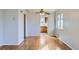 Bright dining area featuring hardwood floors, a ceiling fan, and a view into the kitchen at 2675 N Saint Paul St, Denver, CO 80205