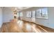 Open-concept living room featuring hardwood floors, seamless connection to the dining area, and lots of natural light at 2675 N Saint Paul St, Denver, CO 80205