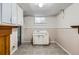 Room with cabinets and sink, neutral walls, and tiled floor at 2675 N Saint Paul St, Denver, CO 80205