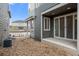 Backyard patio with sliding glass doors and xeriscaping at 5319 Warrior St, Frederick, CO 80504