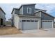 Modern two-story townhome featuring a two-car garage and appealing curb appeal at 5319 Warrior St, Frederick, CO 80504
