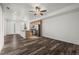 Open living area to the modern kitchen, and bright front entry, showcasing an open-concept design at 5319 Warrior St, Frederick, CO 80504