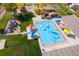Aerial view of a splash pad area with sunshades and play equipment, surrounded by a park at 5319 Warrior St, Frederick, CO 80504