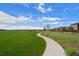 Well-maintained community walking path through green spaces and landscaping at 5319 Warrior St, Frederick, CO 80504