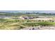 Aerial community view shows a high school, a sports field and the surrounding area at 22962 Briar Leaf Ave, Parker, CO 80138