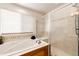 Bright bathroom featuring a soaking tub with jets, and a separate glass enclosed shower at 22962 Briar Leaf Ave, Parker, CO 80138