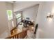 Open entryway featuring hardwood floors, vaulted ceilings, and sun-filled living area at 22962 Briar Leaf Ave, Parker, CO 80138