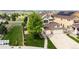 Aerial view of home showing three-car garage, landscaping and neighborhood at 22962 Briar Leaf Ave, Parker, CO 80138