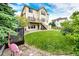 Spacious two-story home with lush backyard, patio, and a deck, perfect for outdoor living at 22962 Briar Leaf Ave, Parker, CO 80138