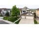 Beautiful home with a three-car garage, lush front yard, and inviting curb appeal on a corner lot at 22962 Briar Leaf Ave, Parker, CO 80138