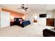 Comfortable main bedroom with a large walk-in closet, plush carpet, and vaulted ceilings at 22962 Briar Leaf Ave, Parker, CO 80138