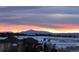 Scenic view of the sunset over the snow-covered landscape and the mountain range at 22962 Briar Leaf Ave, Parker, CO 80138