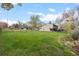 Spacious backyard with a well-maintained lawn and partial fencing along the property line at 1000 Zang St, Golden, CO 80401