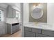 Chic bathroom with marble countertop, stylish gray vanity, and gold fixtures at 1000 Zang St, Golden, CO 80401