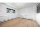 Minimalist dining room with wood floors, modern chandelier, and bright natural light at 1000 Zang St, Golden, CO 80401